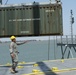 441st Transportation Company (Seaport Operations), directs the movement of a cargo container