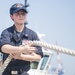 USS Fitzgerald sailors heave mooring line