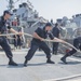 USS Fitzgerald sailors heave mooring line