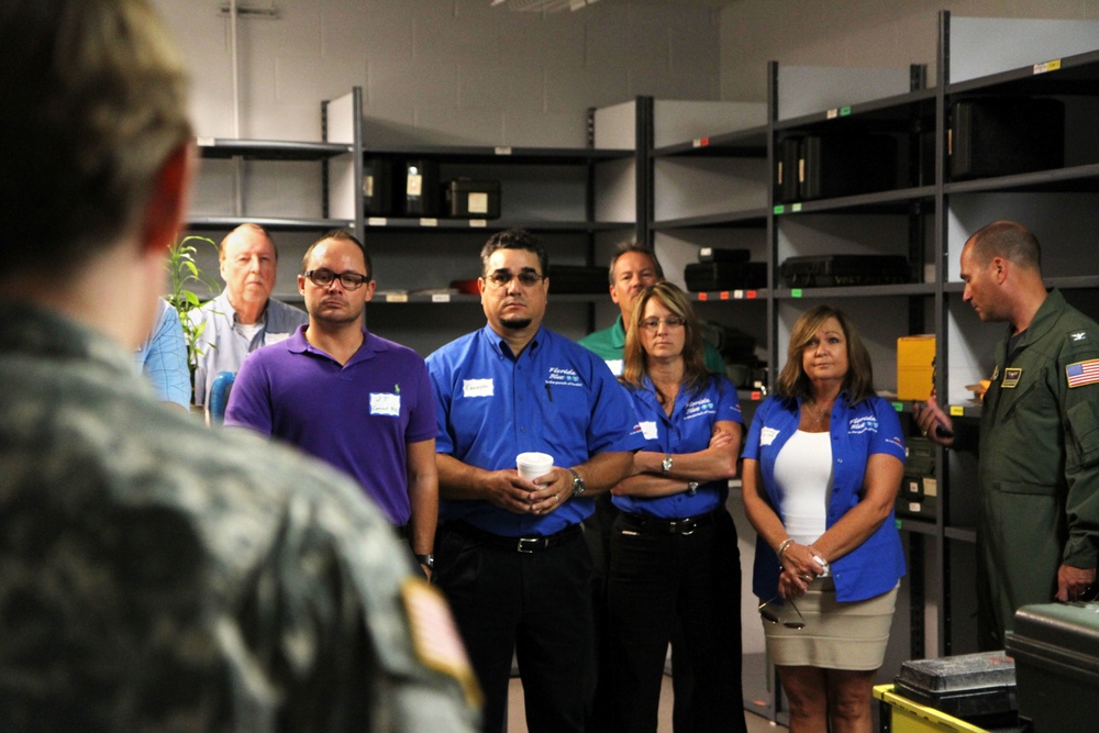 Civic leaders and business members of surrounding community tour installation