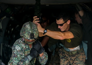 U.S. and Philippine Marines fast rope from Ospreys