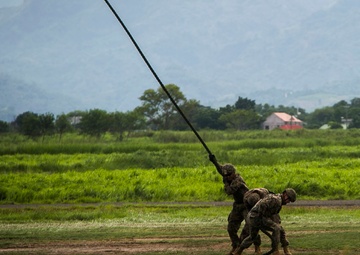 U.S. and Philippine Marines fast rope from Ospreys