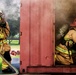 Firefighters battle simulated fire
