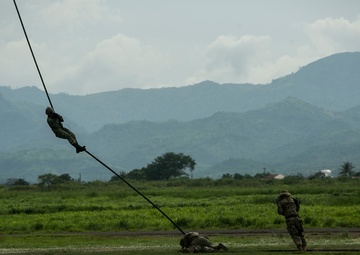 U.S. and Philippine Marines fast rope from Ospreys