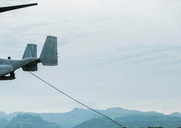U.S. and Philippine Marines fast rope from Ospreys