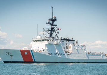Prior to its commissioning in Boston, US Coast Guard cutter James anchors near Boston Light