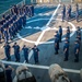 Crew members of the US Coast Guard cutter James stand at attention