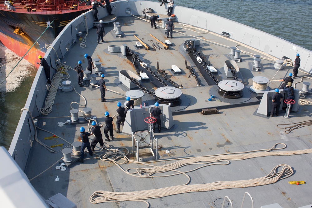 USS Arlington pulls into port