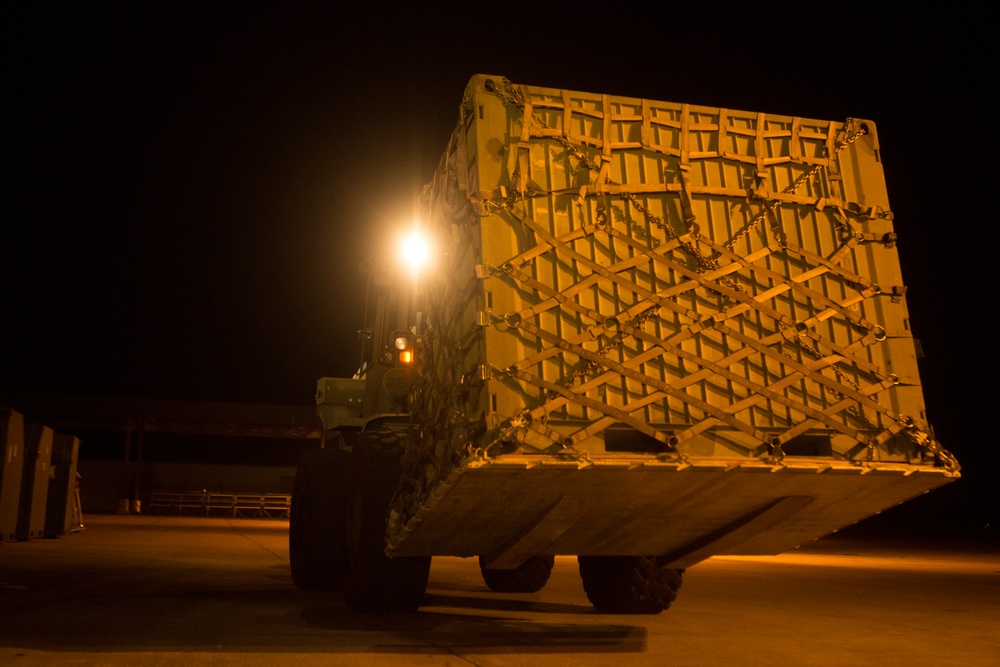 VMAQ-3 loads cargo onto commercial cargo aircraft