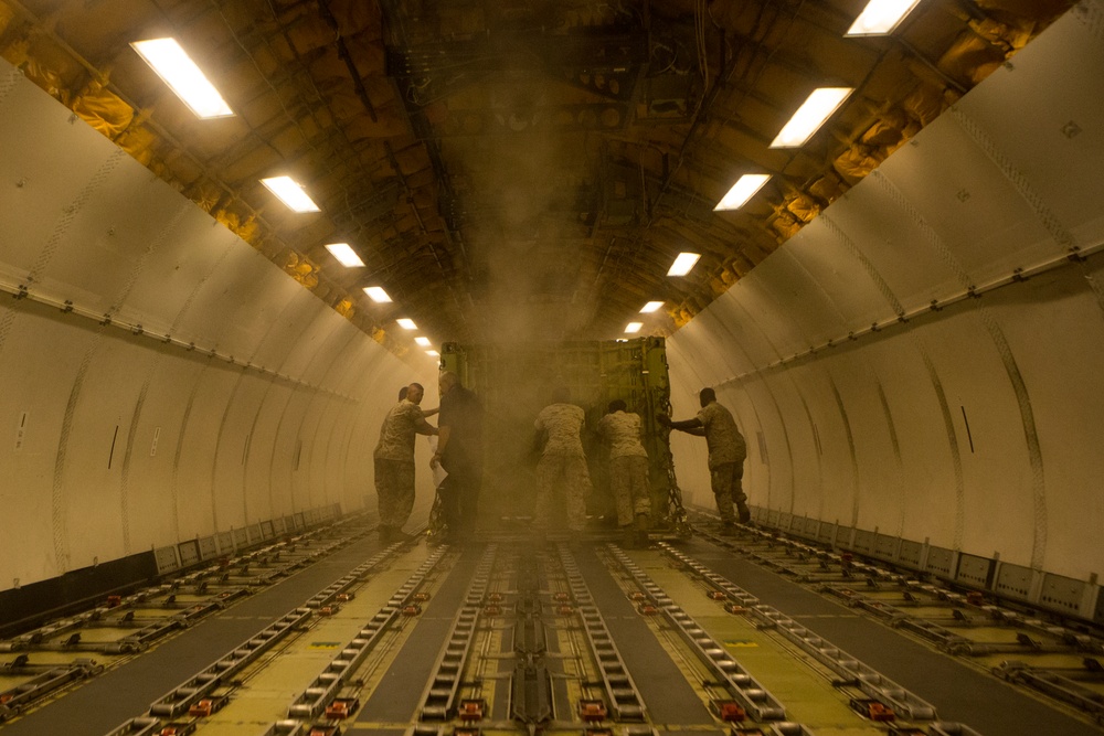 VMAQ-3 loads cargo onto commercial cargo aircraft