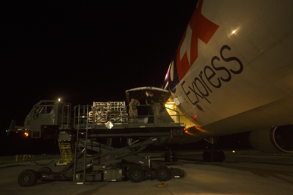 VMAQ-3 loads cargo onto commercial cargo aircraft