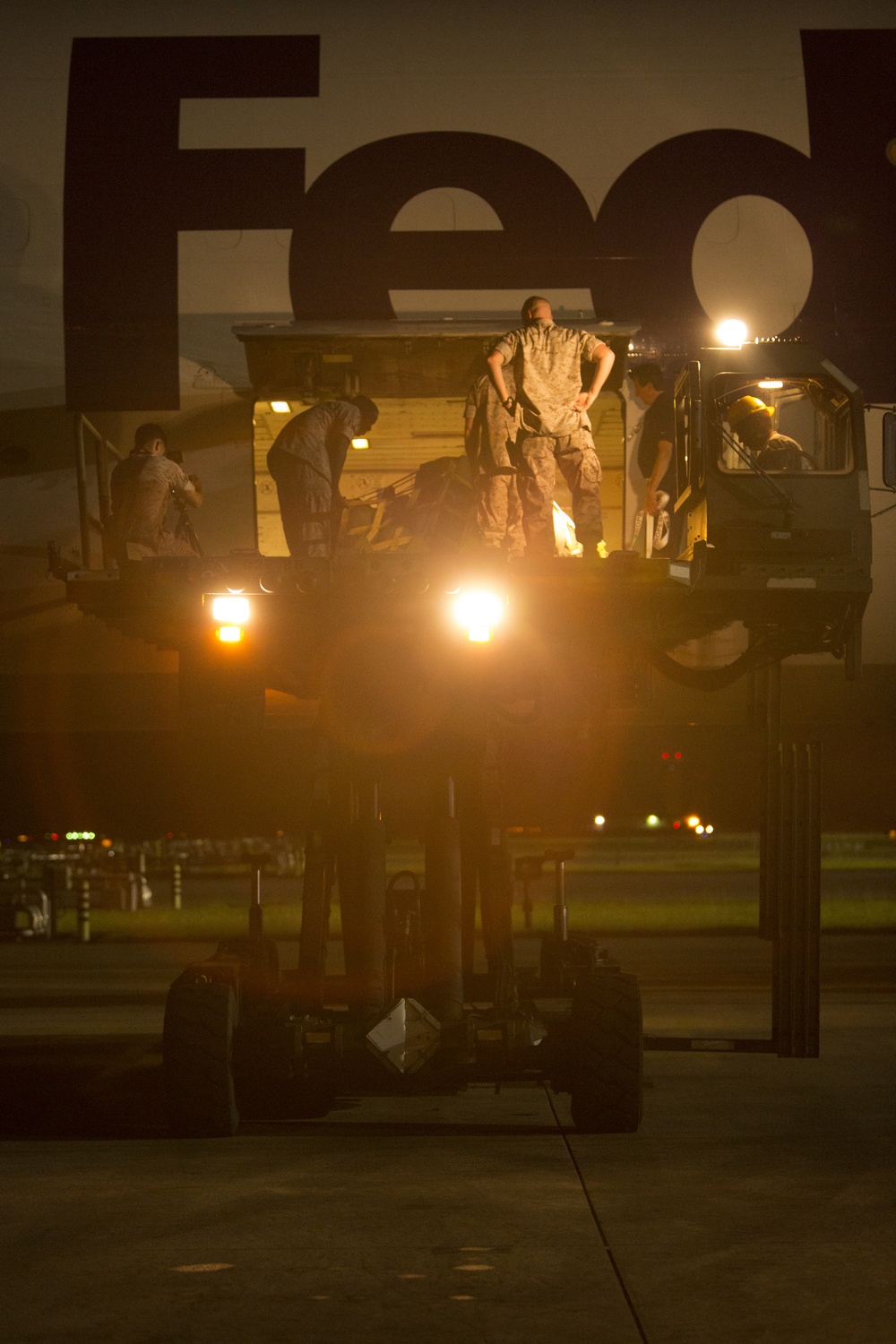 VMAQ-3 loads cargo onto commercial cargo aircraft