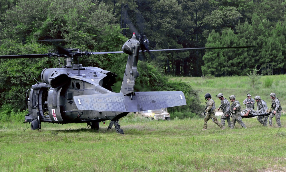 Loading a 'casualty' during medical evacuation exercise at Fort Polk, La