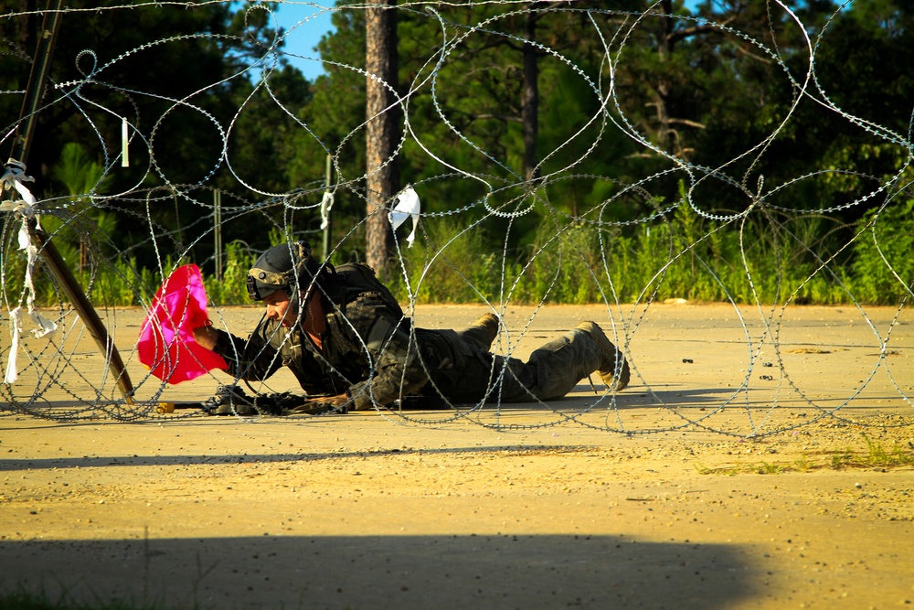 Cutting a path through concertina wire during annual training at Fort Polk, La.