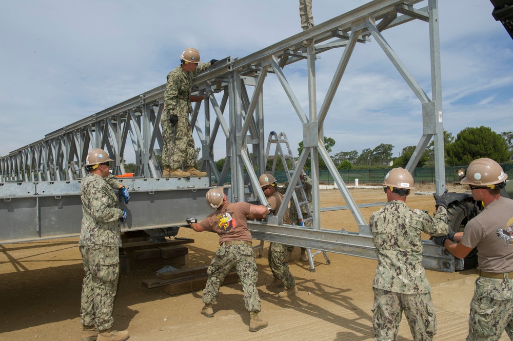 Naval Mobile Construction Battalion 4 trains to erect a Mabey Johnson Bridge