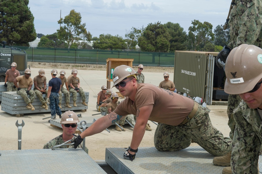 Naval Mobile Construction Battalion 4 trains to erect a Mabey Johnson Bridge