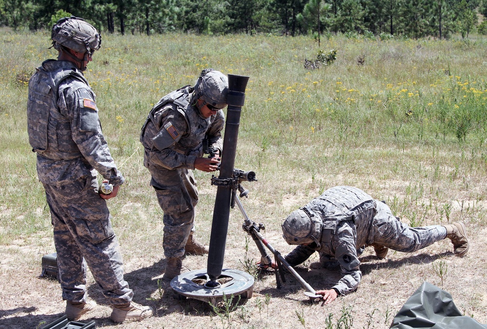 Iowa National Guard Soldiers ready 60mm mortar tube for fire mission