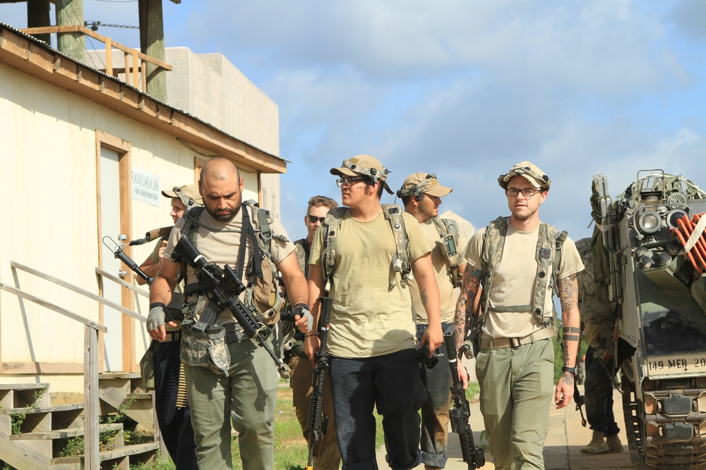 Members of the Texas National Guard, take a break from their oppositional forces role-playing at Fort Polk, La.