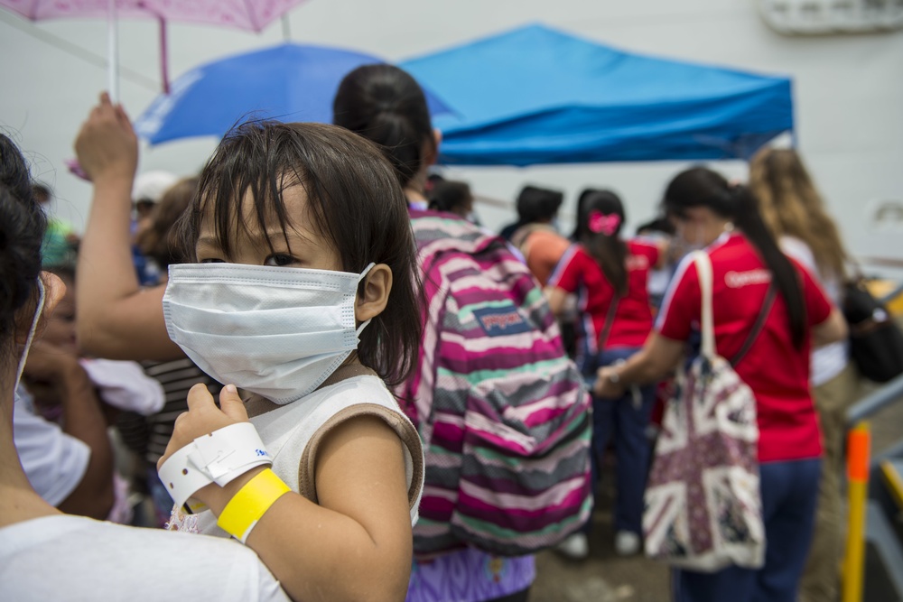 Operation Smile patients board USNS Mercy during Pacific Partnership 2015