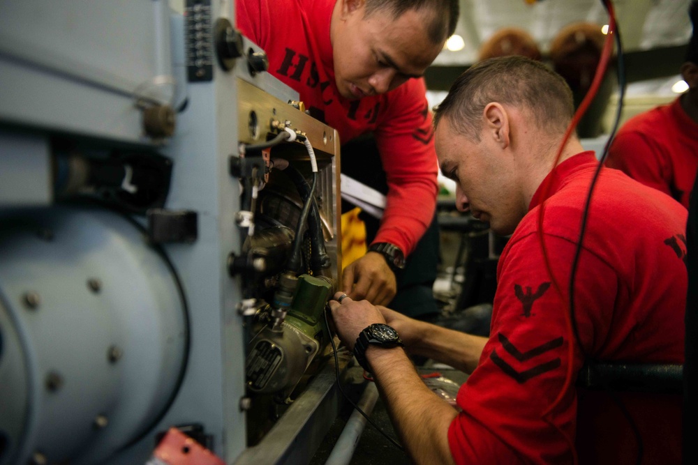 USS John C. Stennis sailors at work