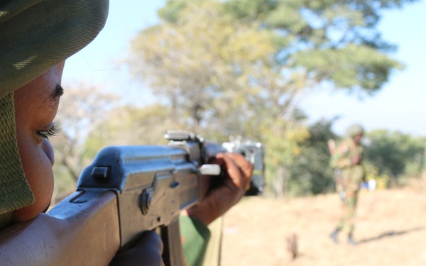 A Zambian Soldier scans his sector of fire during squad movements