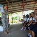 Service members read to Philippine elementary students