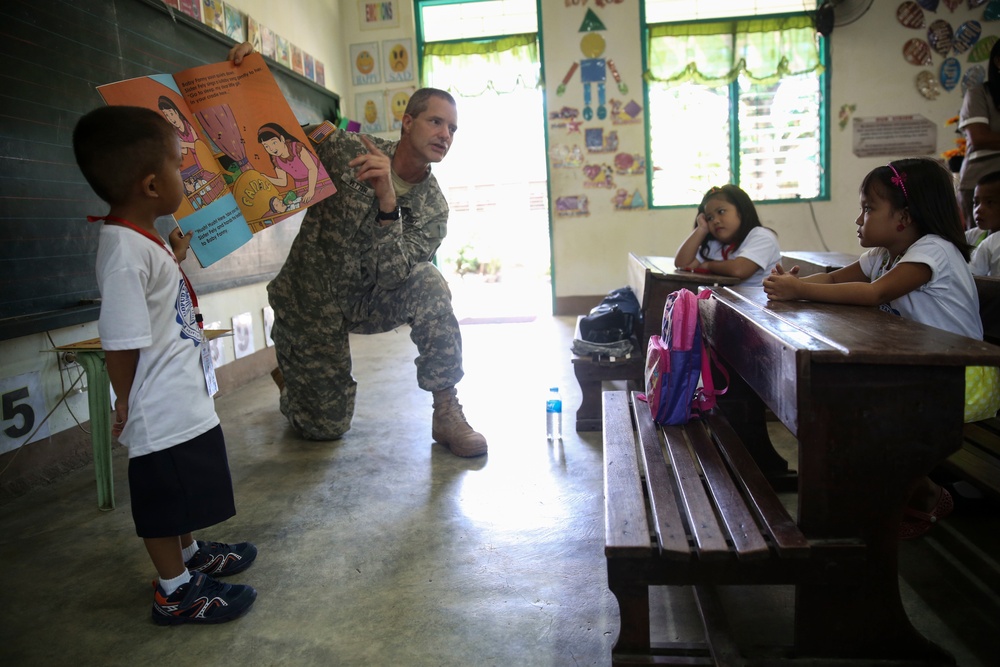 Service members read to Philippine elementary students