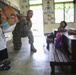 Service members read to Philippine elementary students