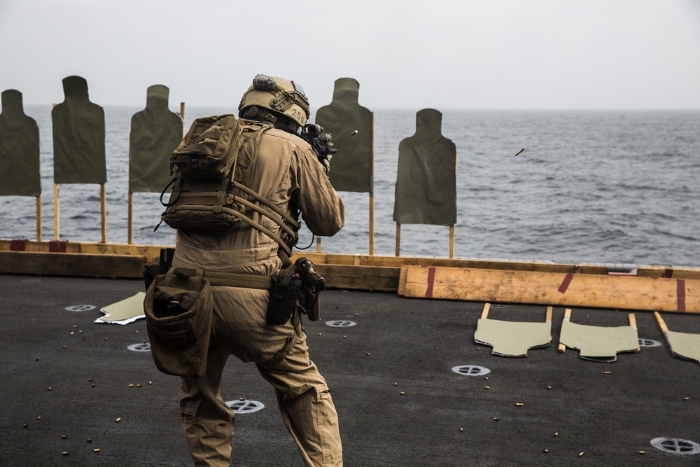 U.S. Marines practice barricade shooting at sea