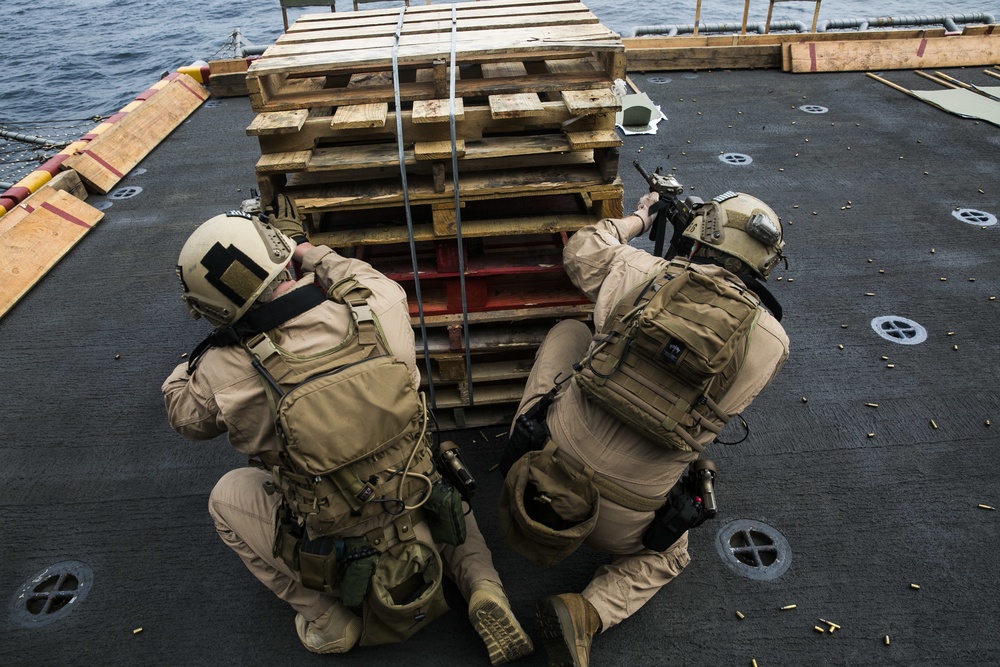 U.S. Marines practice barricade shooting at sea