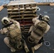 U.S. Marines practice barricade shooting at sea