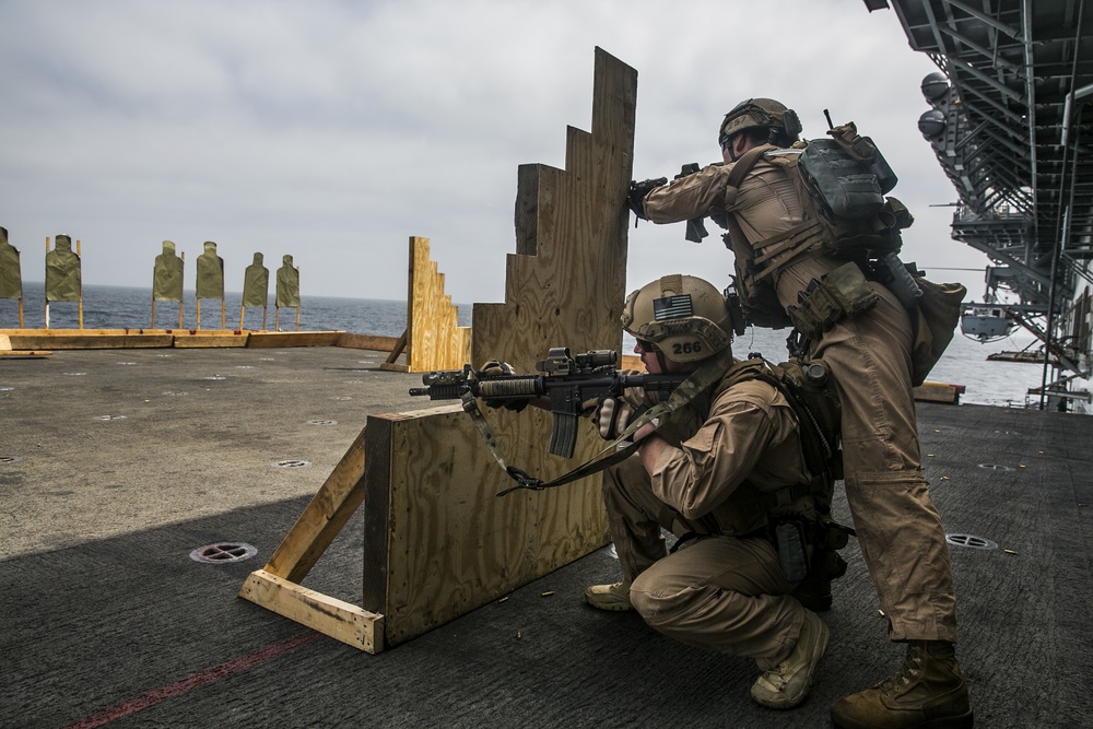 U.S. Marines practice barricade shooting at sea