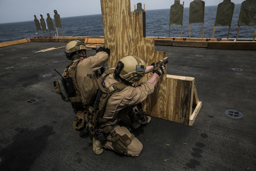 U.S. Marines practice barricade shooting at sea