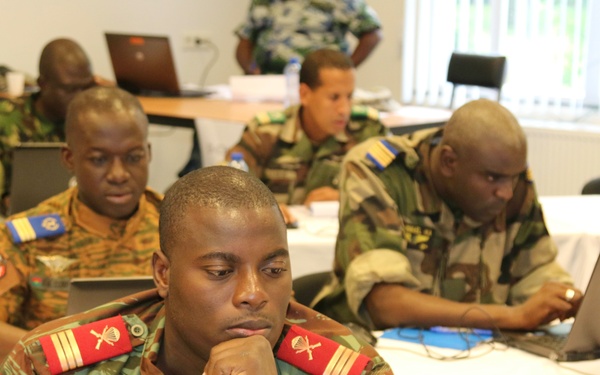 Staff members participating in Western Accord 15 prepare for the upcoming simulated command post exercise
