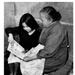 Child teaching grandmother to read