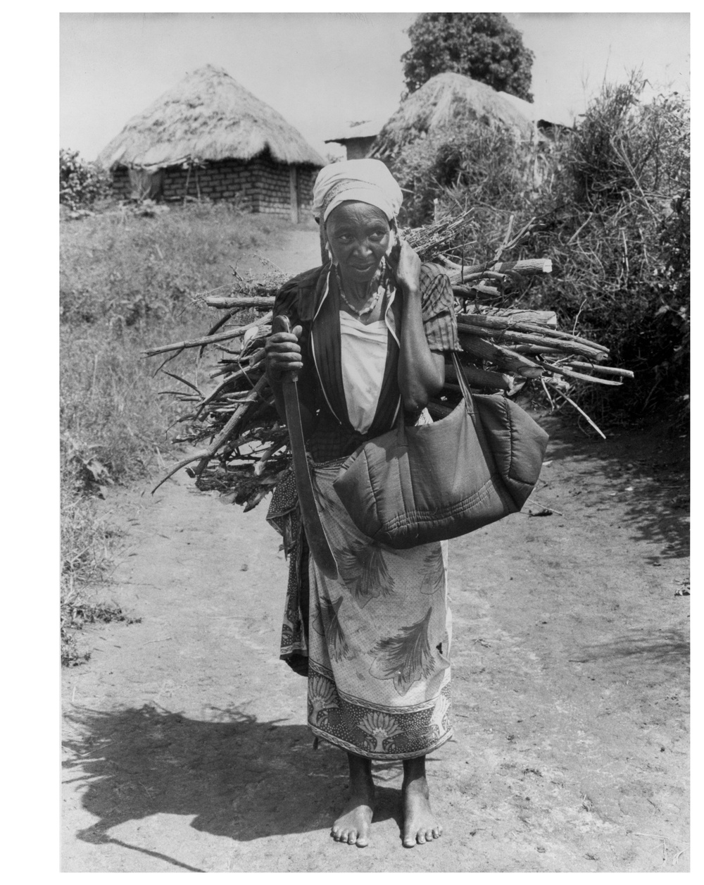 Ngii carries firewood - Katheka, Kenya