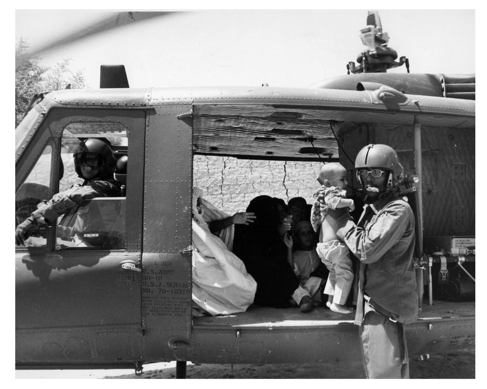U.S. helicopters taking aboard flood victims for evacuation at Imamabad