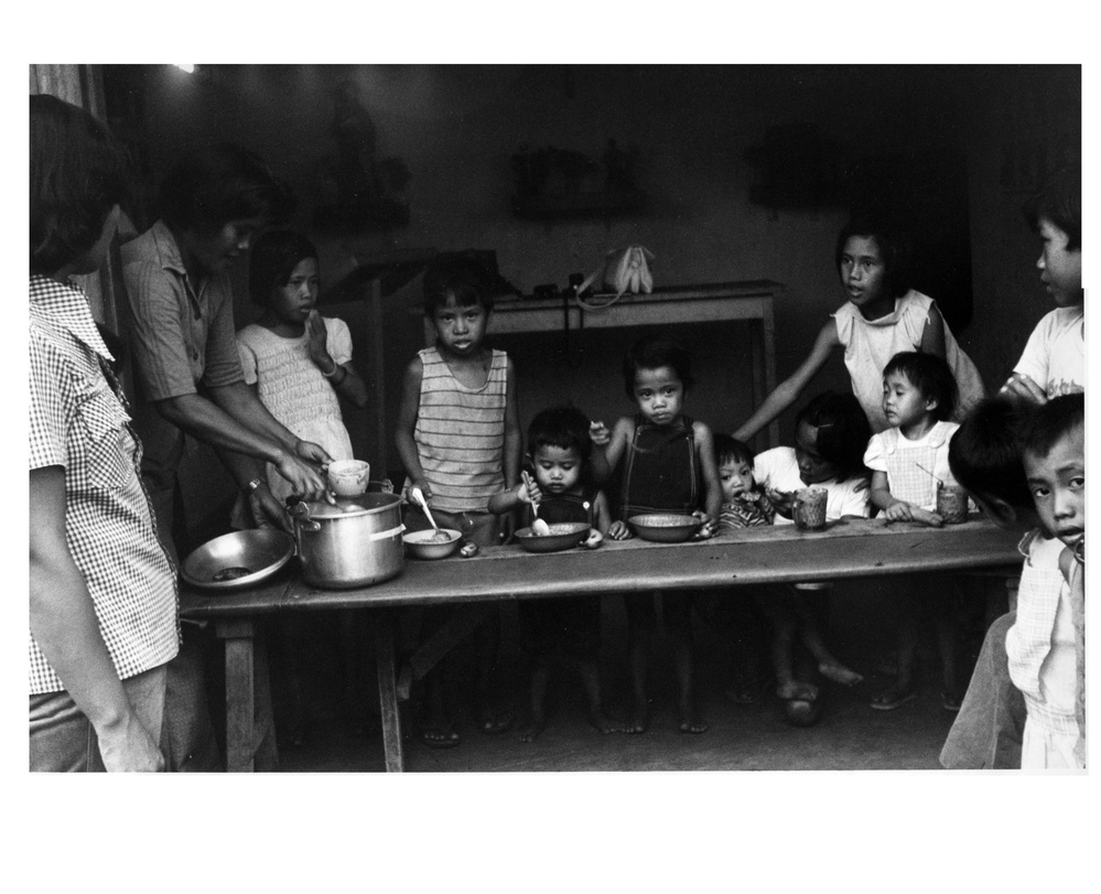 Children being fed food for peace meal, Philippines