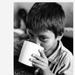 Boy drinking from cup - El Salvador