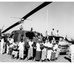 East Pakistanis loading American helicopter with disaster relief rice supplies