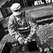 Railroader works on a coupler that connects railcars