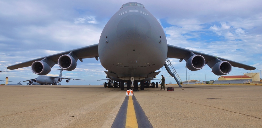 Soldiers and Airmen at Travis prepare to move cargo