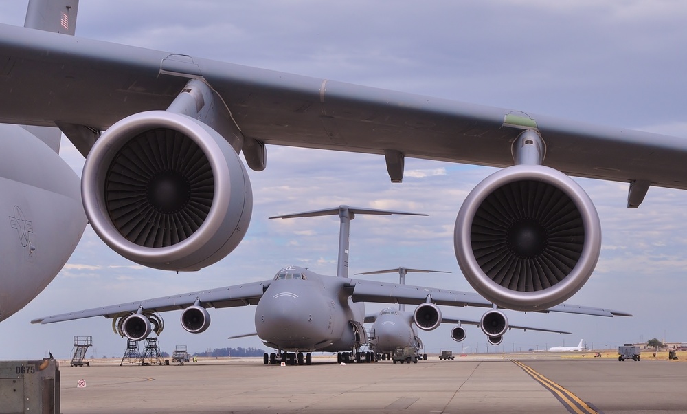 A troop of C-5 Aircraft stand ready