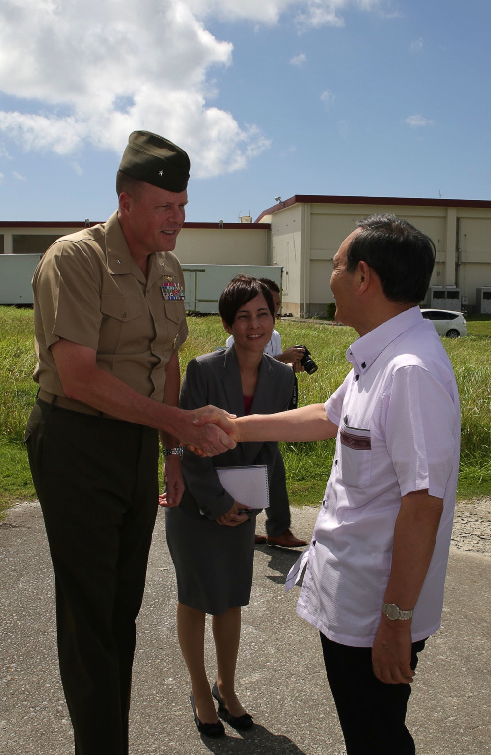 Japan Chief Cabinet Secretary visits Okinawa land return sites