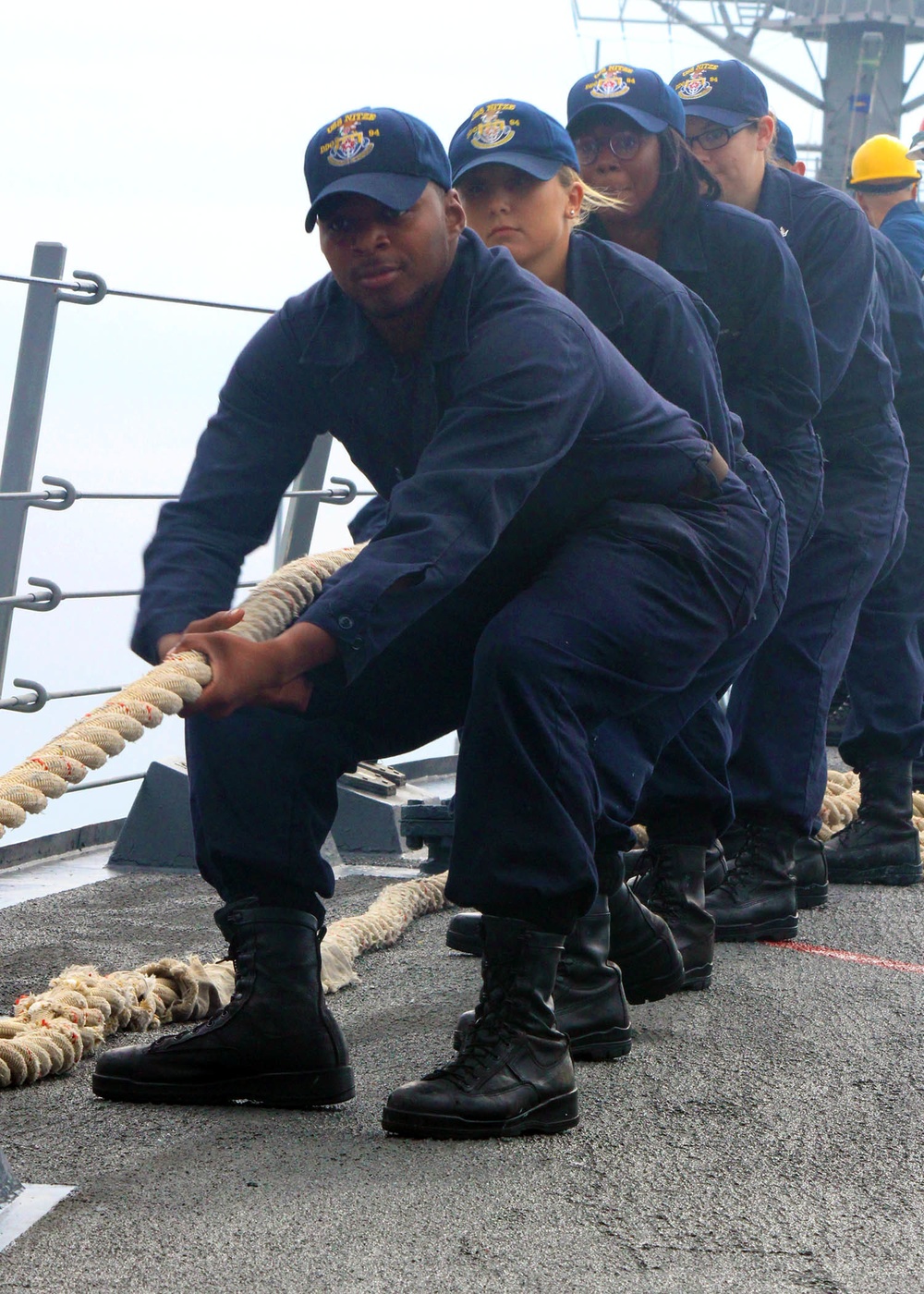 USS Nitze Sailors heave a mooring line