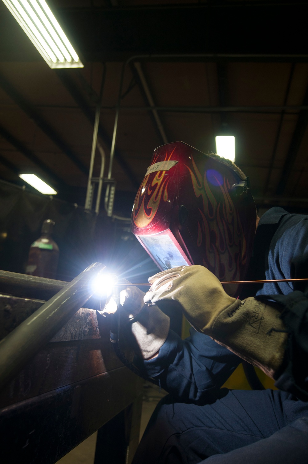 Lincoln Sailor welds metal at LIFAC