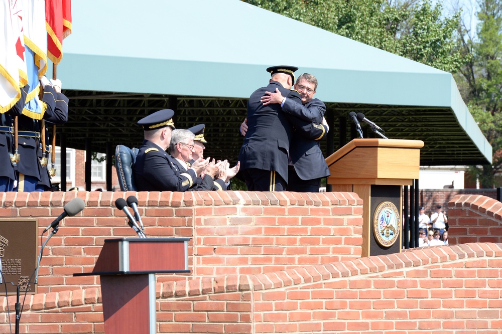Secretary of defense embraces outgoing CSA