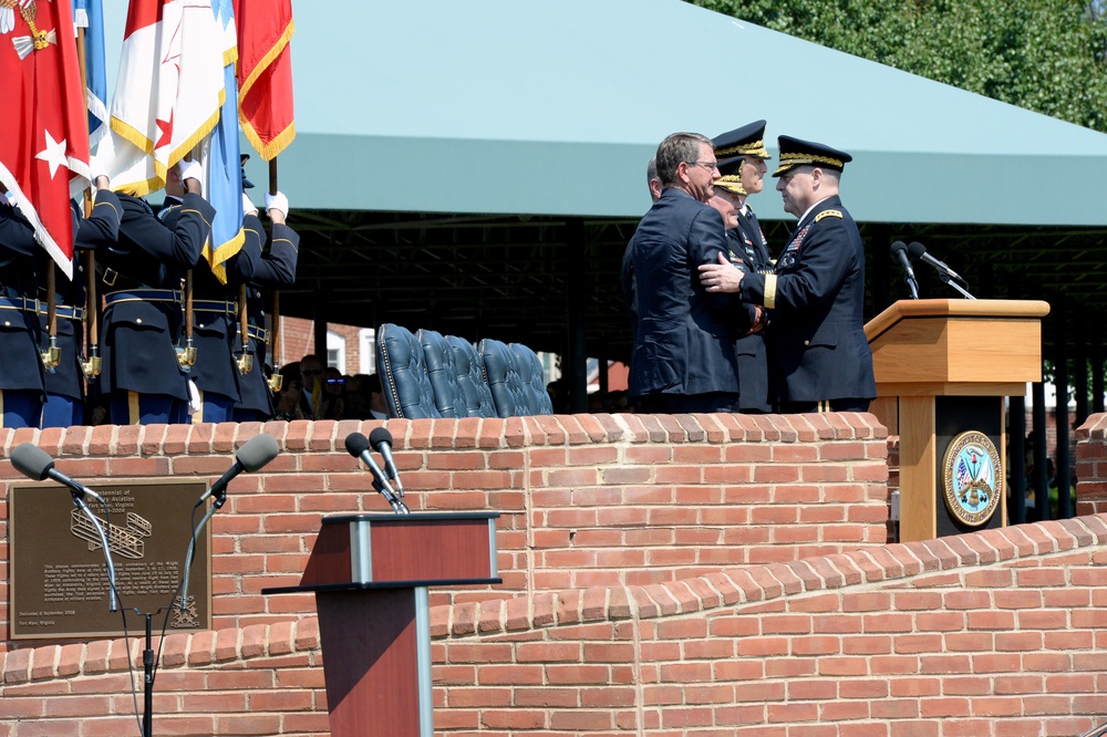 Secretary of defense shakes hands with incoming CSA