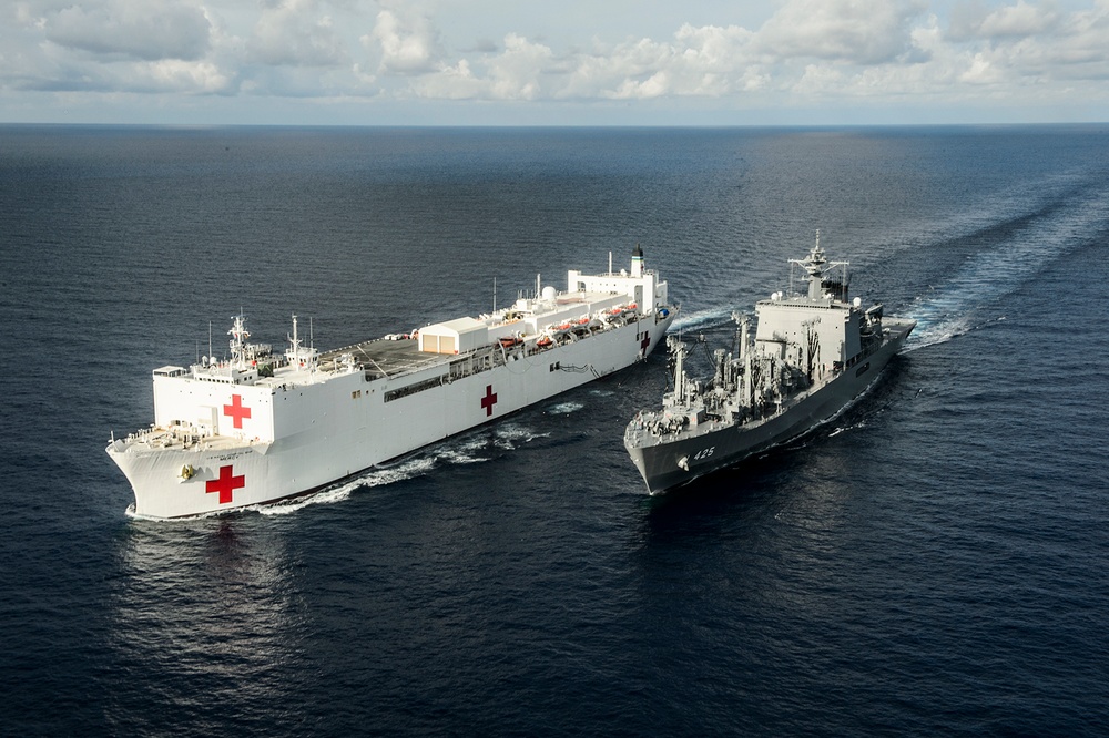 USNS Mercy and JS Mashu conduct replenishment at sea