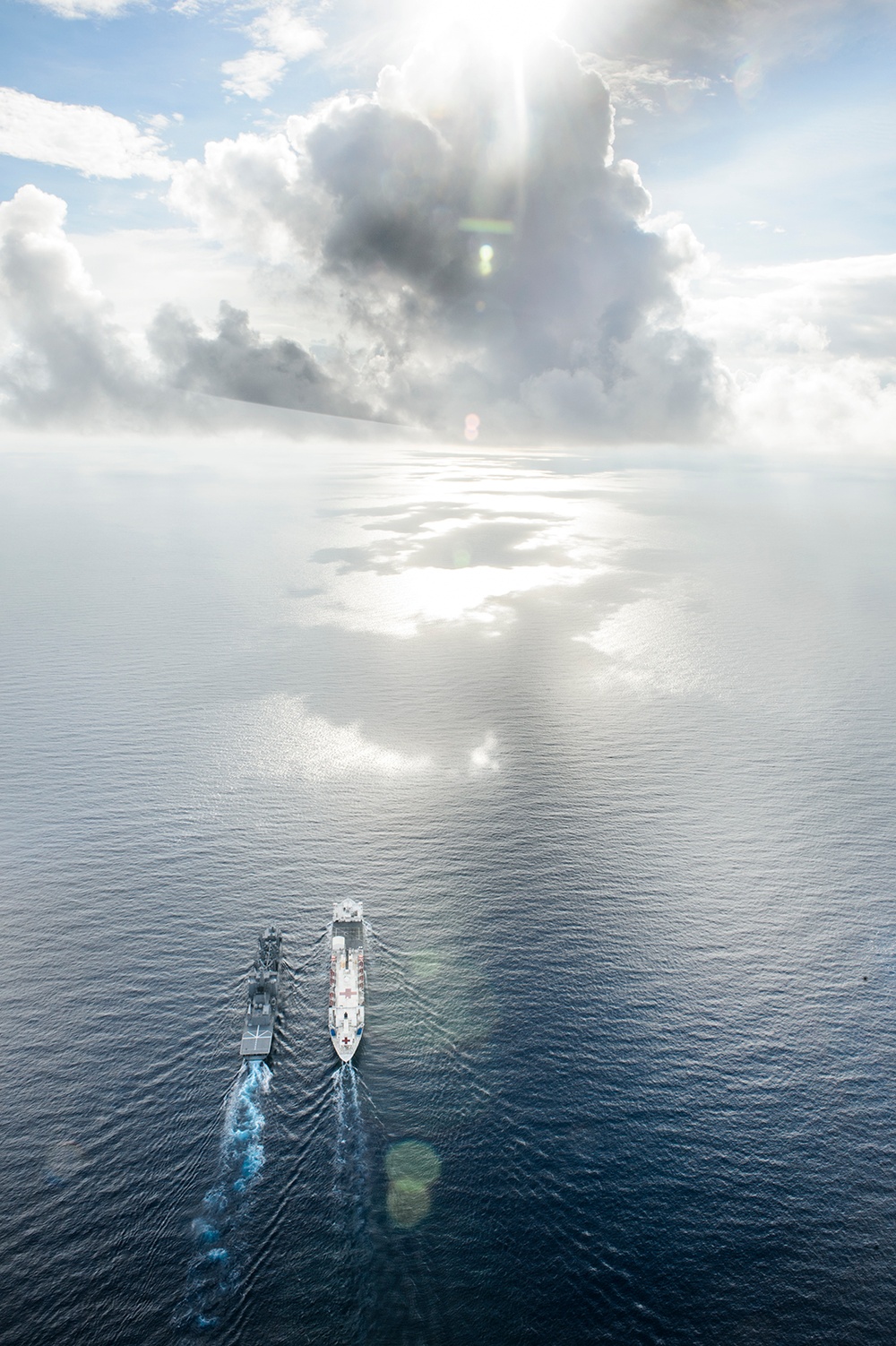 USNS Mercy and JS Mashu conduct replenishment at sea